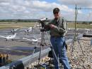 Ueli Hauser, KB9TTI/HB9TTI, on the roof of the Boulder Amateur Radio Club's radio station located in the FBO at the airport. These were the ATV cameras and transmitters providing images for emergency managers. [KB9TTI photo]